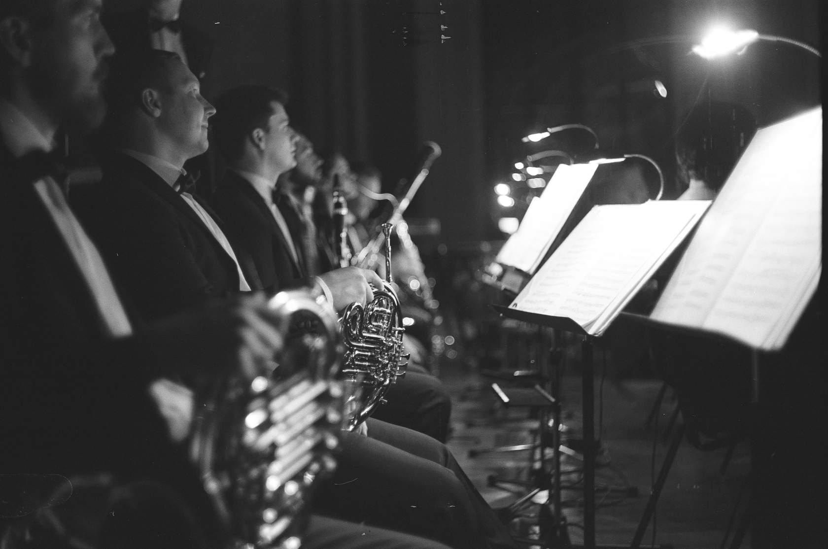 A pit orchestra prepares to play music for a show.